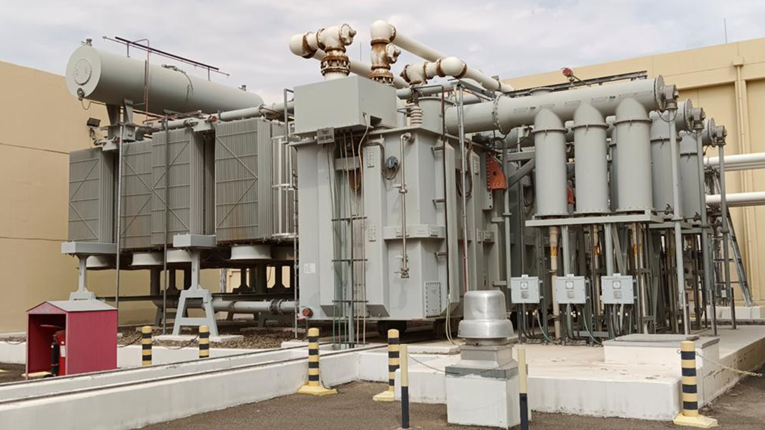 Outdoor power transformer with radiator banks, conservator tanks and control enclosures